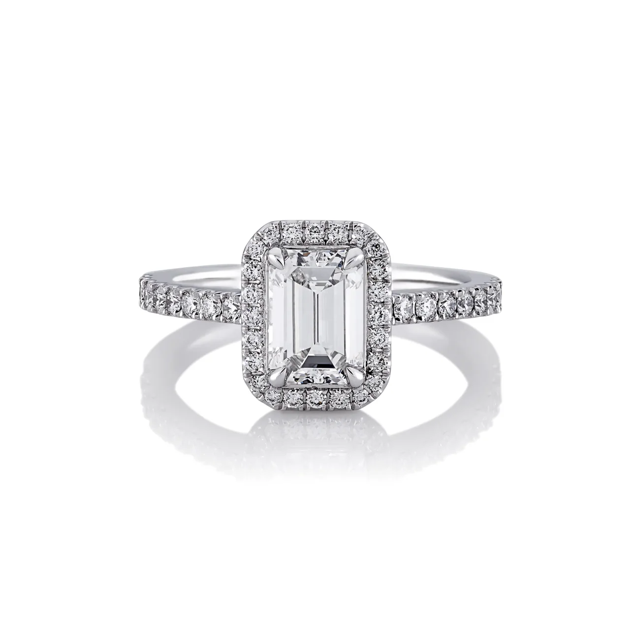VERNAZZA UPSWEPT - 18ct white gold emerald and round brilliant cut diamond halo engagement ring