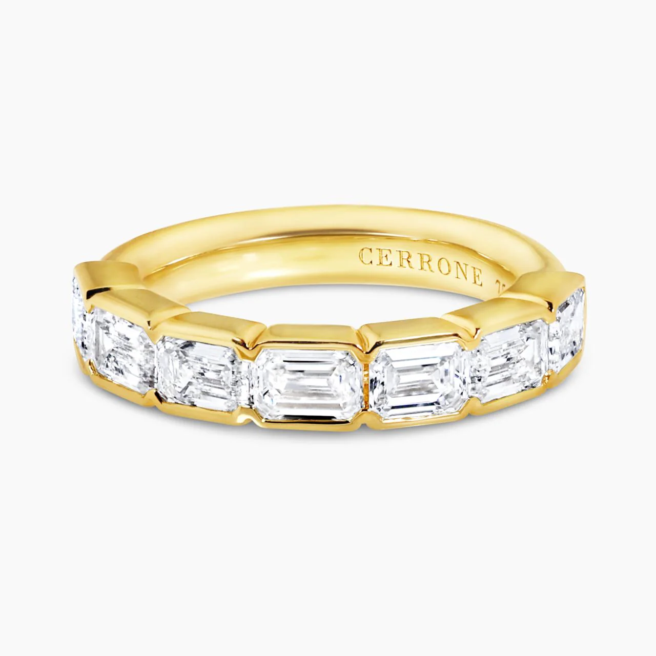 18ct yellow gold 7=2.25ct emerald cut diamonds ring in a half bezel setting